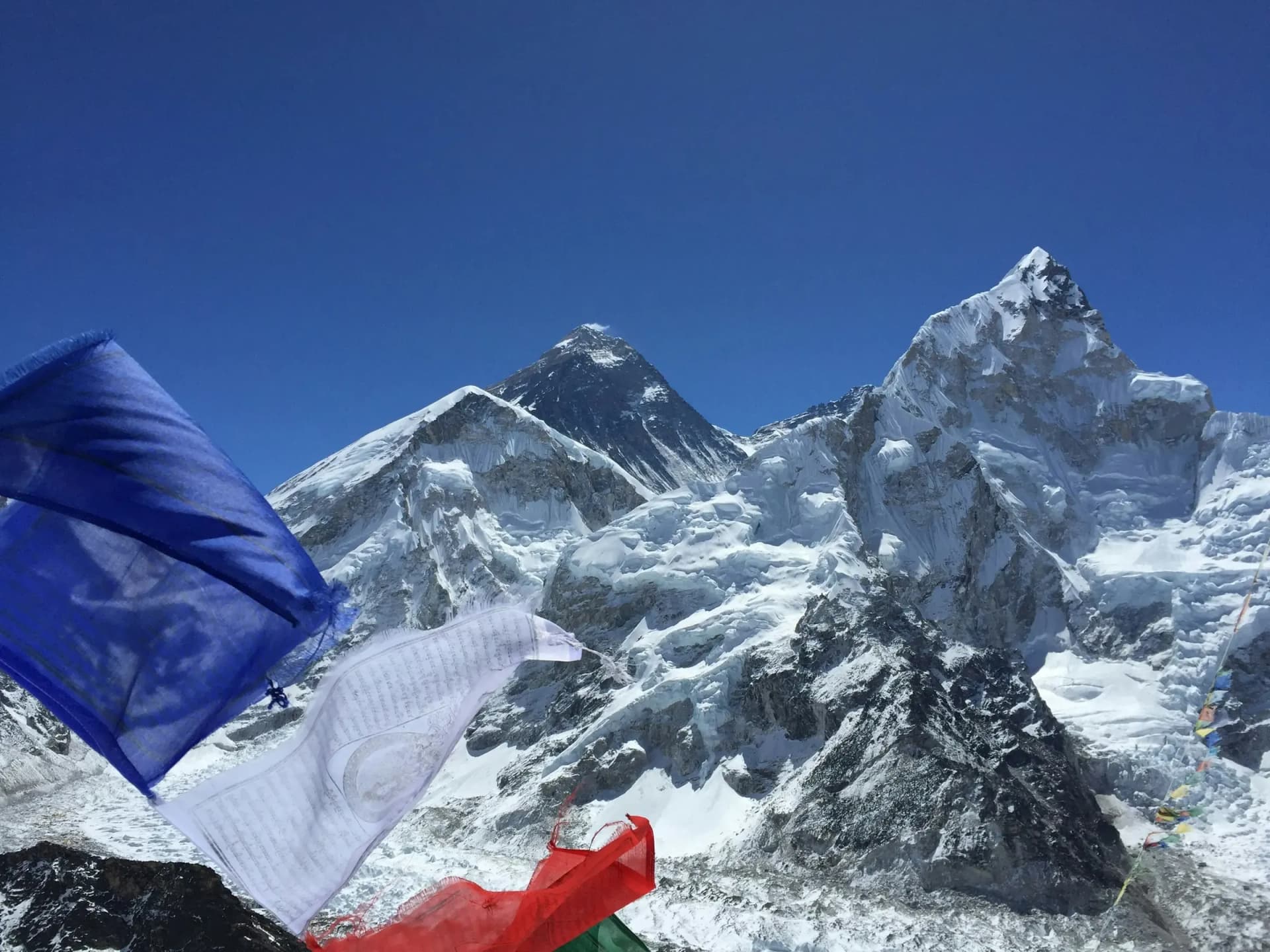 Mount Everest and Nuptse framed by prayer flags on the Everest Base Camp trail