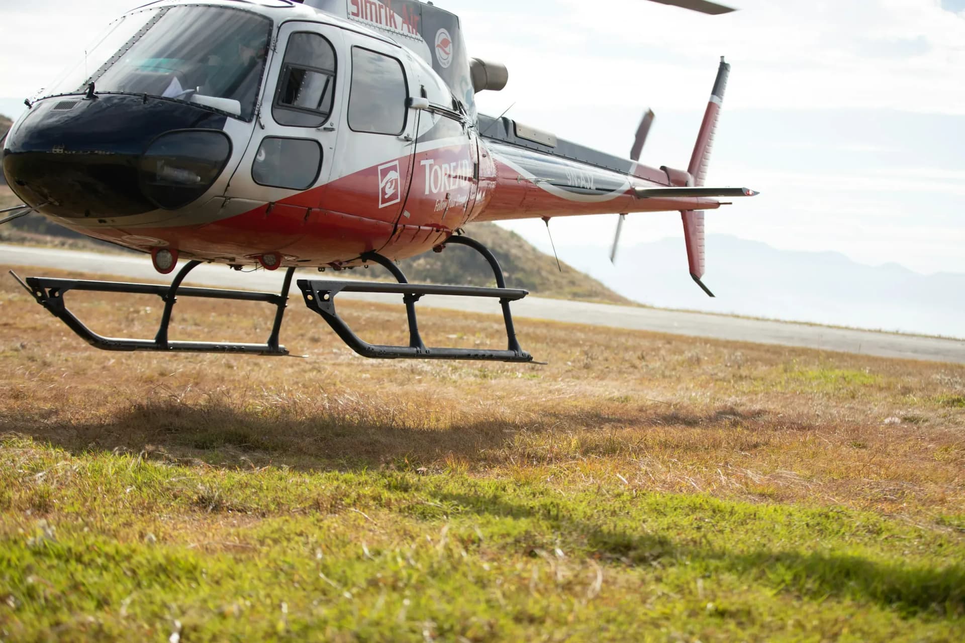 Helicopter landed on a Himalayan meadow