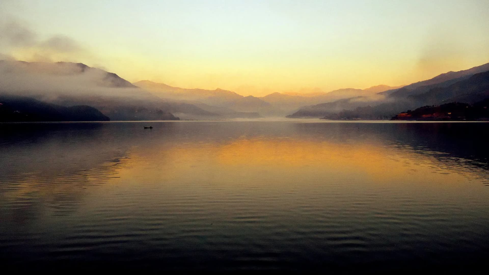 Mist and dawn light over Phewa Lake, Pokhara