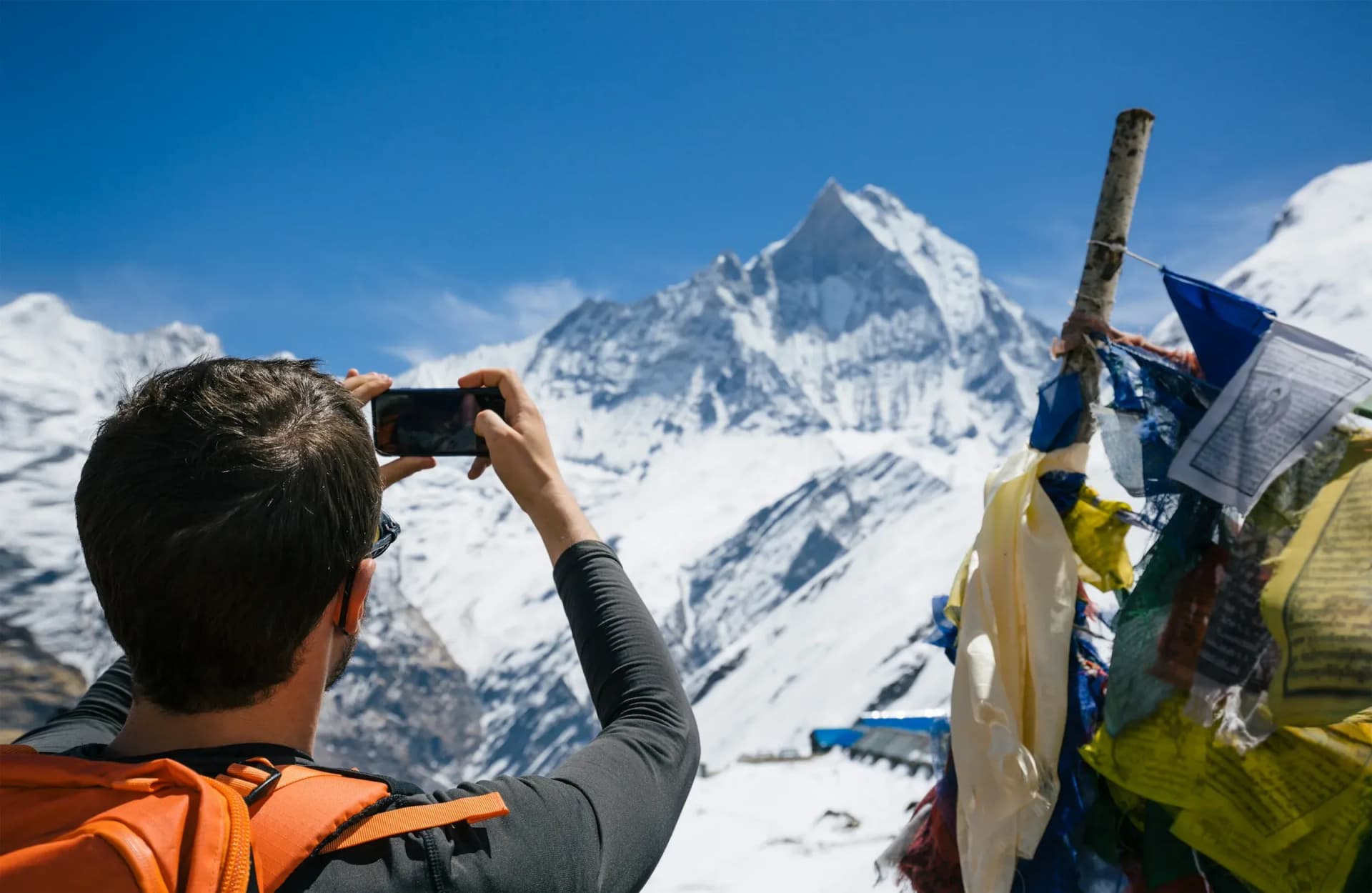 Traveller photographing Machapuchare in the Annapurna Sanctuary