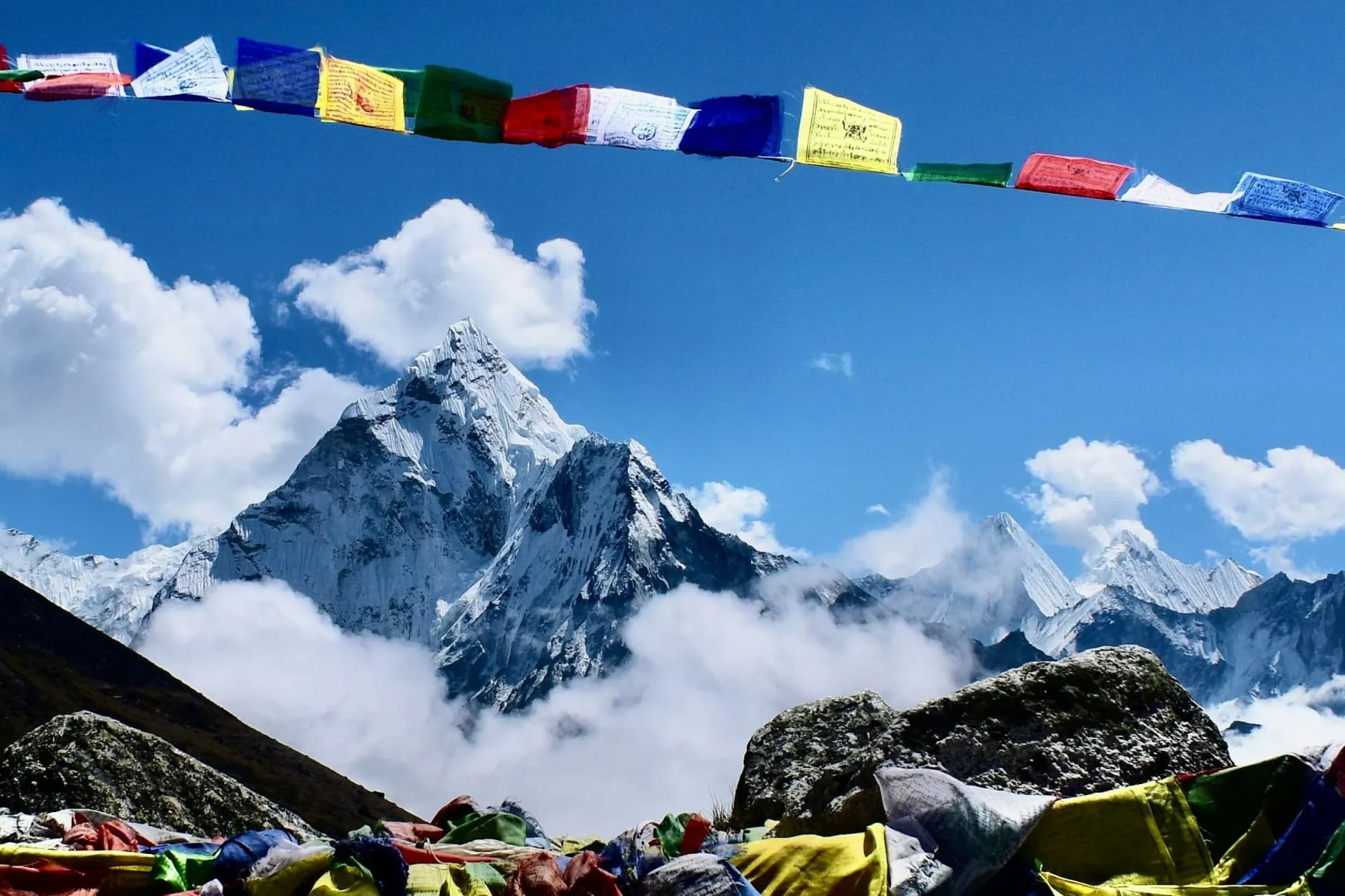 Prayer flags in front of Ama Dablam on a clear day
