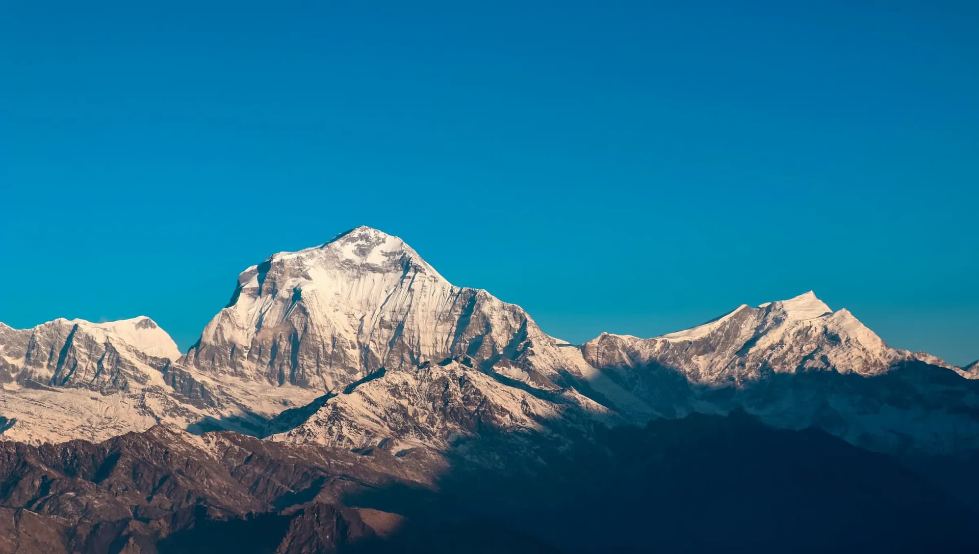 A snow-capped Himalayan massif in clear morning light