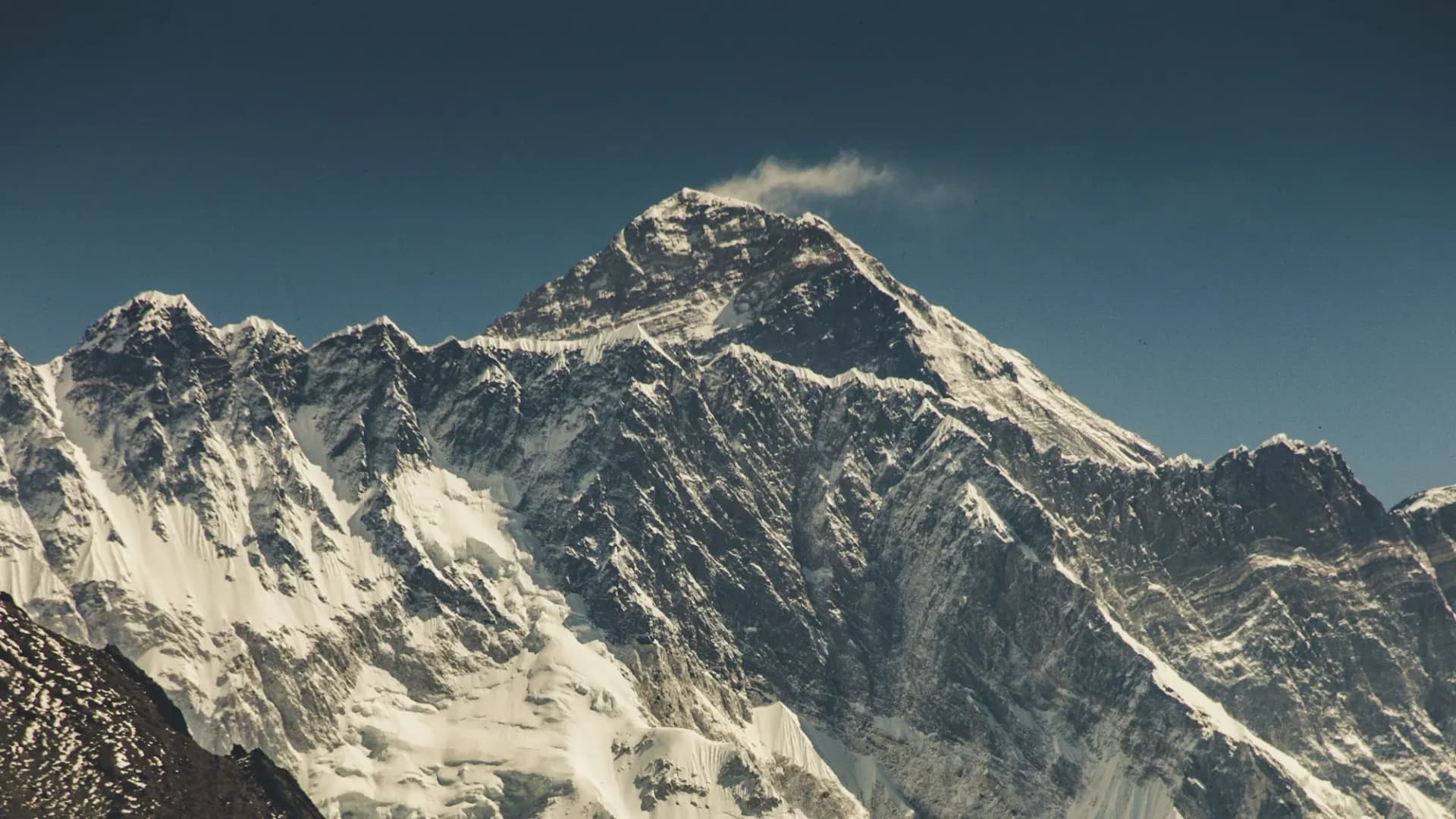 Wind-blown snow plume streaming from a high Himalayan summit