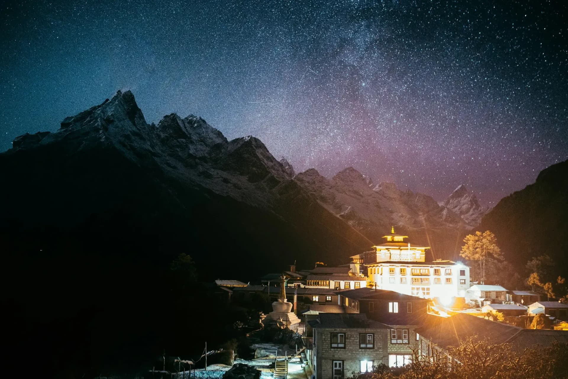 A Khumbu monastery lit up under the night sky