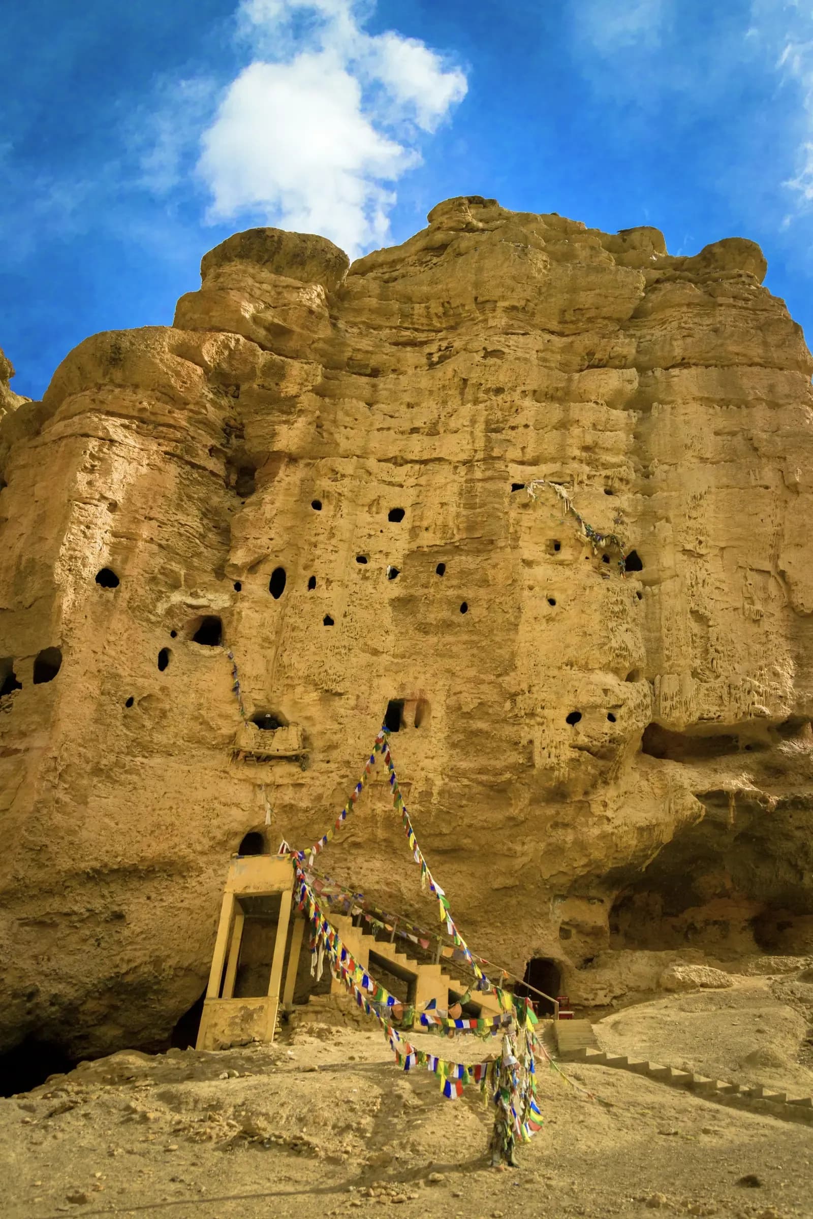 Ancient sky caves carved into the cliffs of Upper Mustang