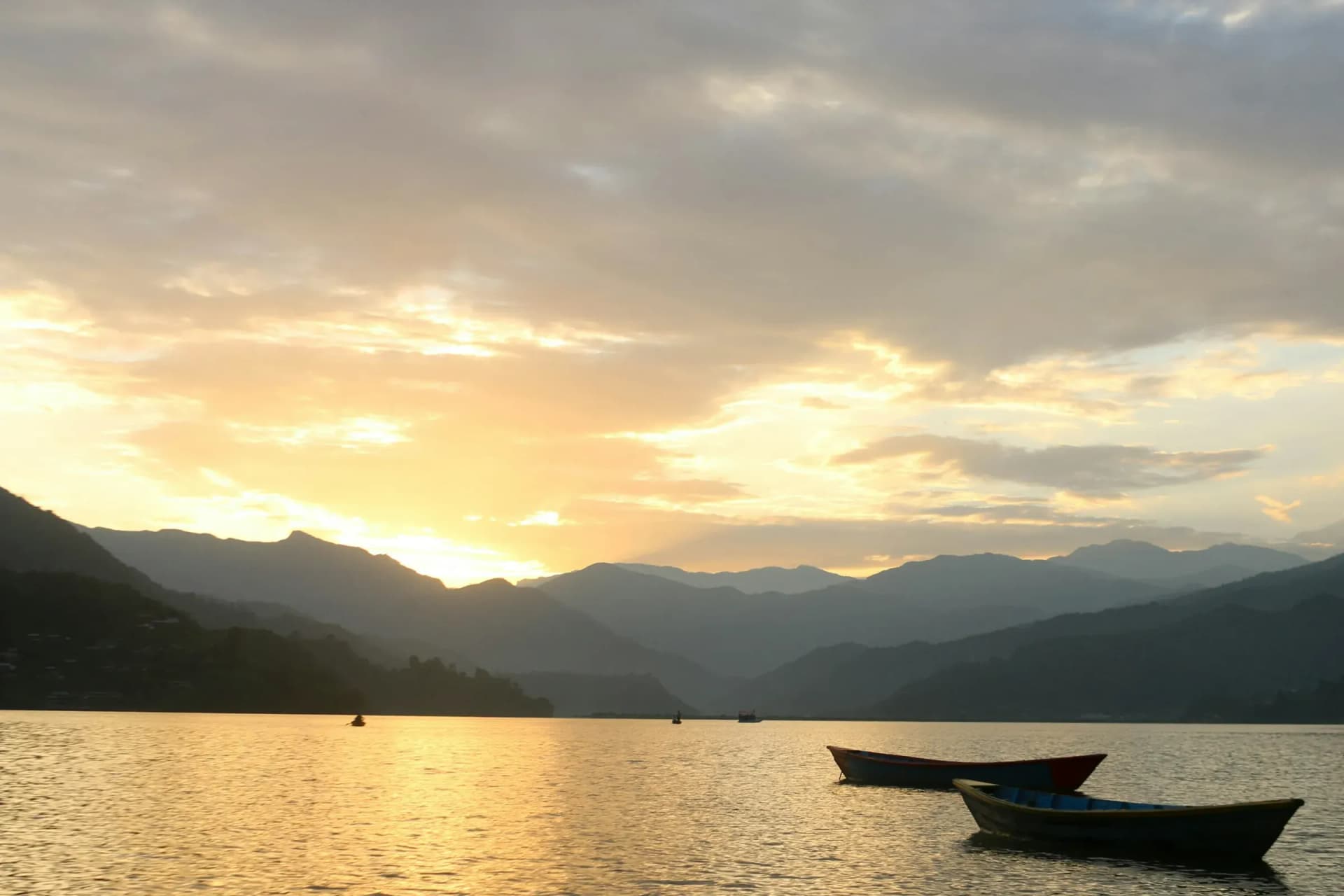 Wooden boats on Phewa Lake at sunset, Pokhara